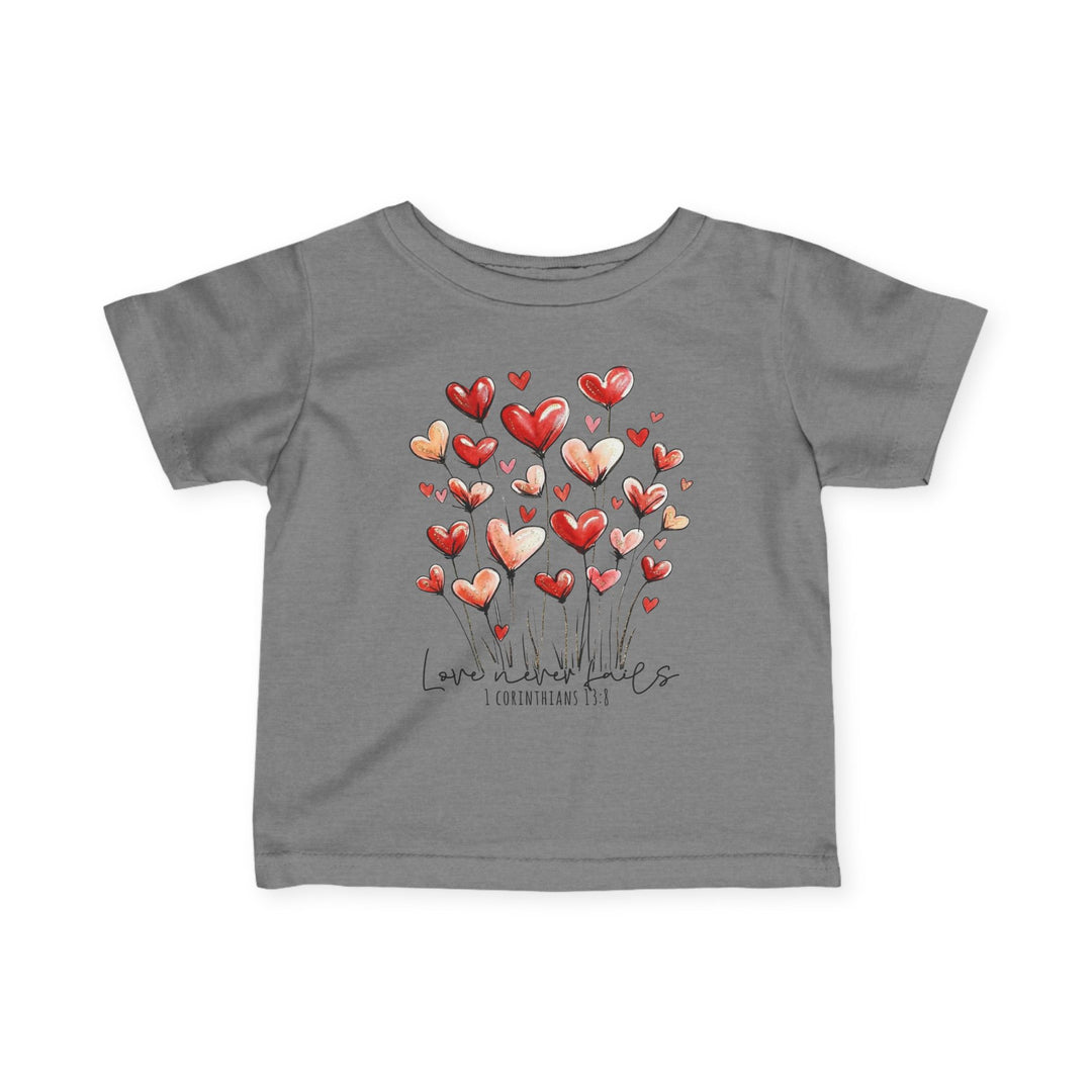 Gray children's T-shirt with heart-shaped flowers and Love never fails text, designed for comfort and durability.