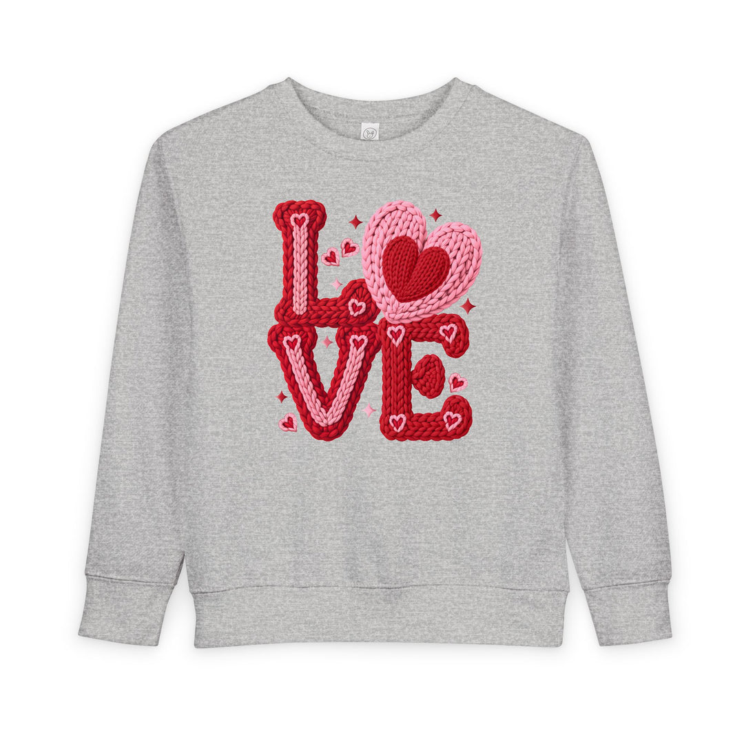 Light-gray crewneck sweatshirt with LOVE in chunky red and pink yarn letters; heart motifs included. Cozy, durable fleece for toddlers.