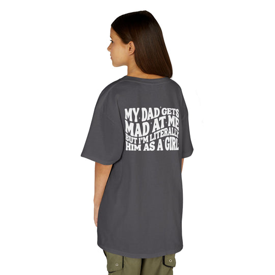 Young person wearing a My Dad Gets Mad at Me Kids Tee in dark gray with humorous white text on the back, perfect for everyday use.