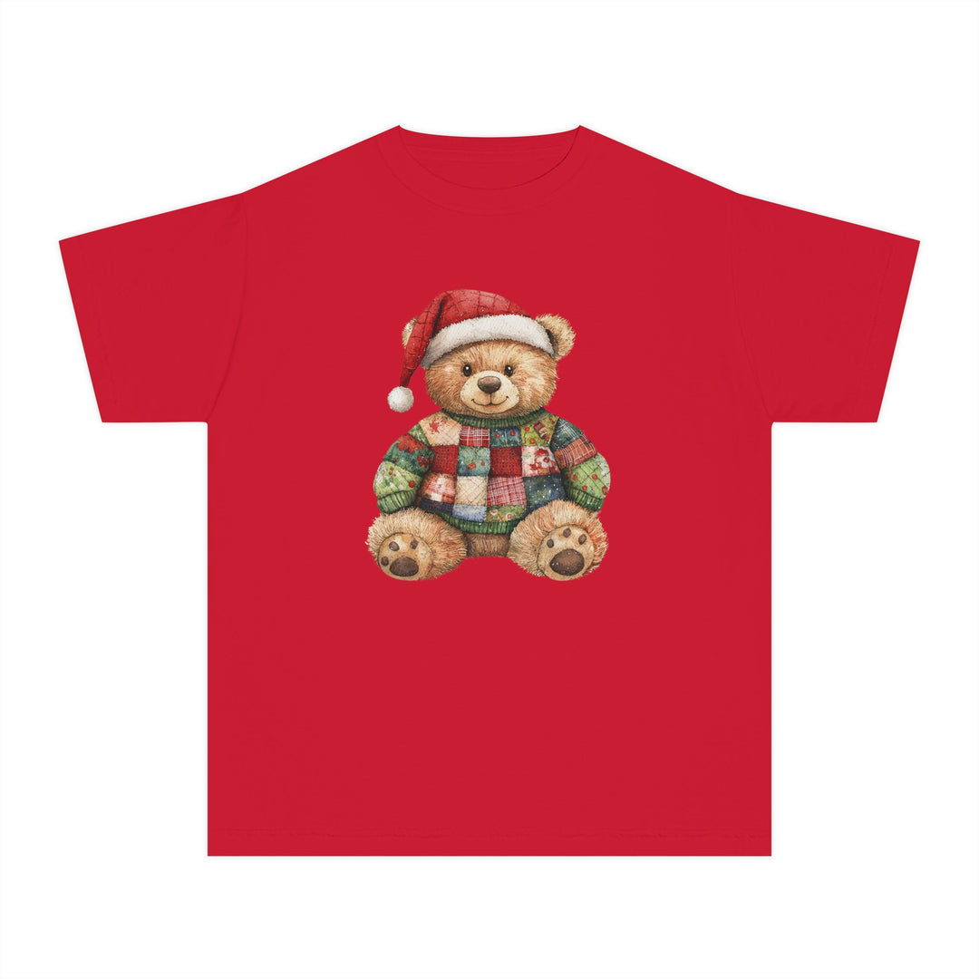 Christmas Bear Kids Tee featuring a teddy bear in a Santa hat and patchwork sweater, perfect for kids' active schedules with its soft, comfortable cotton fabric.