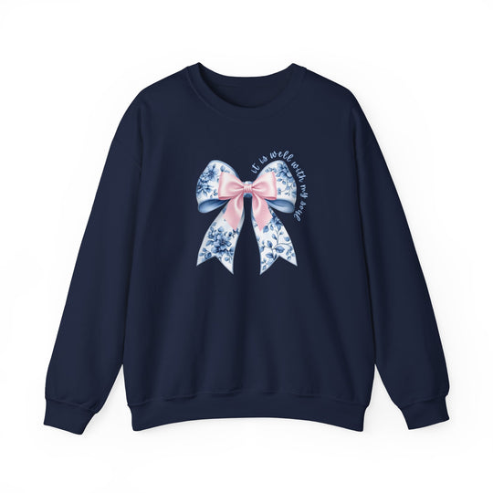 Navy-blue crewneck sweatshirt featuring a decorative bow with floral pattern and It is well with my soul script, combining comfort and style.