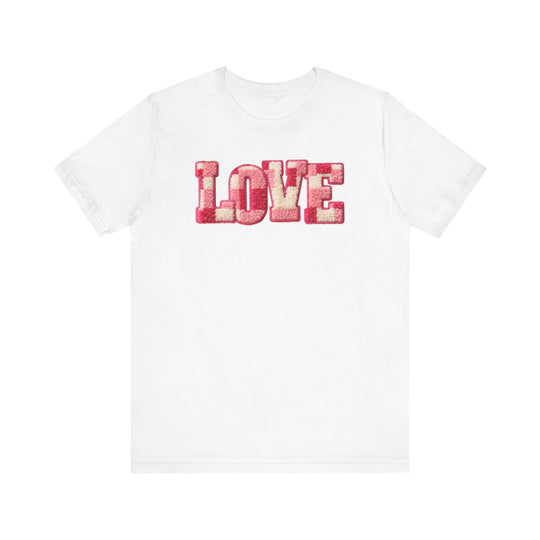 Love Tee featuring LOVE in pink and cream chenille texture on a white cotton shirt, known for its soft feel and durable, stylish fit.