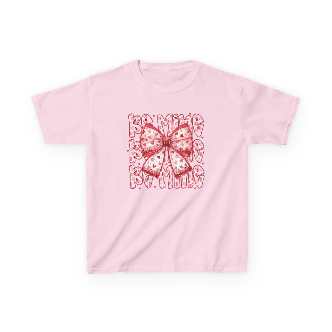 Light-pink Be Mine Kids Tee with a red and pink bow graphic and BE MINE text, featuring tiny heart patterns, ideal for Valentine's Day.