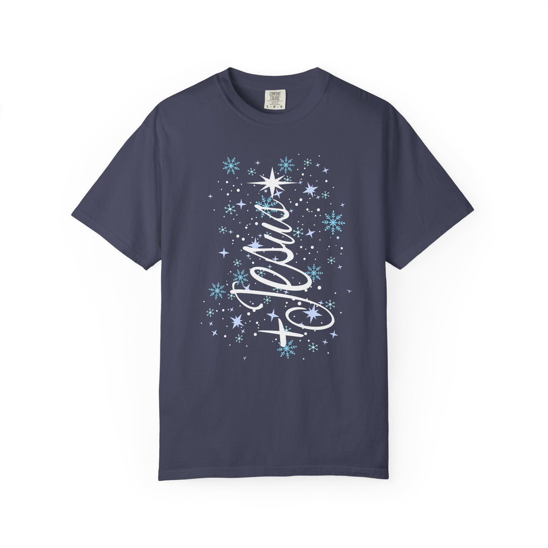 Jesus Tree Tee: Navy Comfort Colors t-shirt with vertical Noels and festive snowflake design, offering a relaxed fit and luxurious fabric blend.