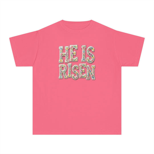 He is Risen Kids Tee featuring floral-patterned text on a pink T-shirt, designed for comfort and agility with 100% combed ring-spun cotton.