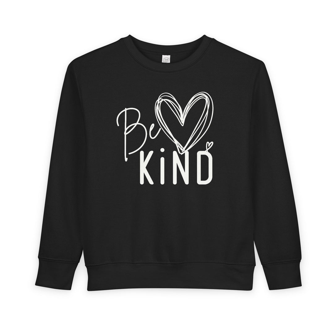 Black toddler crew-neck sweatshirt with Be Kind white graphic, featuring a heart-shaped o. Made from soft, durable cotton-polyester blend for comfort and warmth.