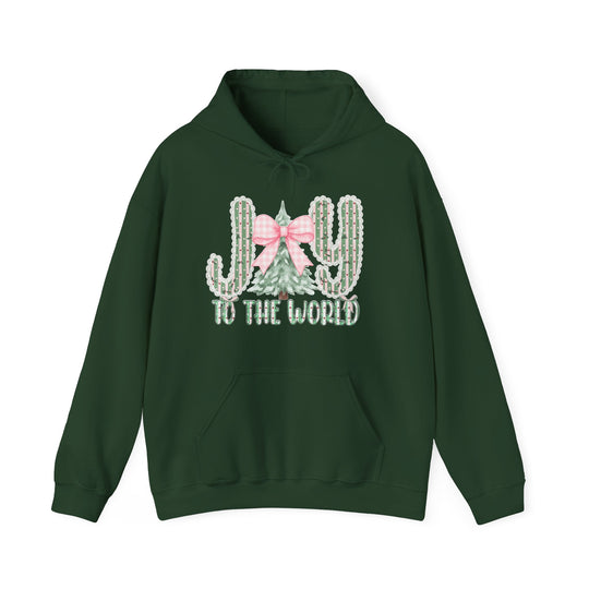 Dark-green pullover hoodie with holiday-themed JOY graphic, featuring lace-trimmed candy-stripe cacti and fir tree, reads JOY to the world. Cozy, unisex design.