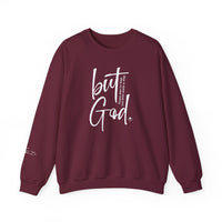 A unisex heavy blend crewneck sweatshirt featuring the But God Crew design. Made of 50% cotton and 50% polyester, offering comfort and durability with a ribbed knit collar and double-needle stitching. Ideal for colder months.