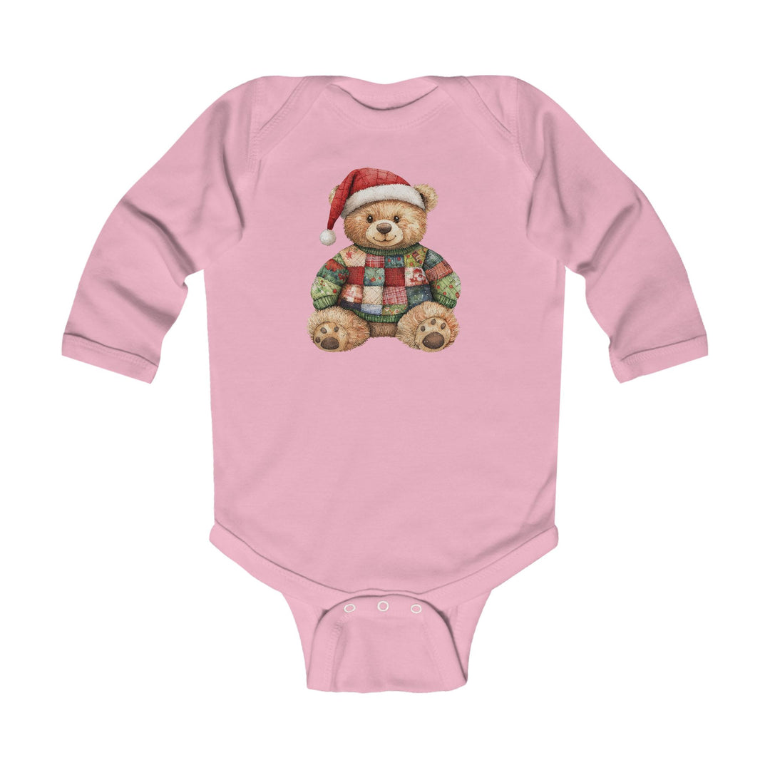 Christmas Bear Onesie: Pink infant bodysuit featuring a teddy bear in a Santa hat and patchwork sweater, designed for durability and comfort with ribbed bindings and easy-change snaps.