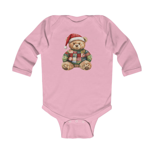Christmas Bear Onesie: Pink infant bodysuit featuring a teddy bear in a Santa hat and patchwork sweater, designed for durability and comfort with ribbed bindings and easy-change snaps.