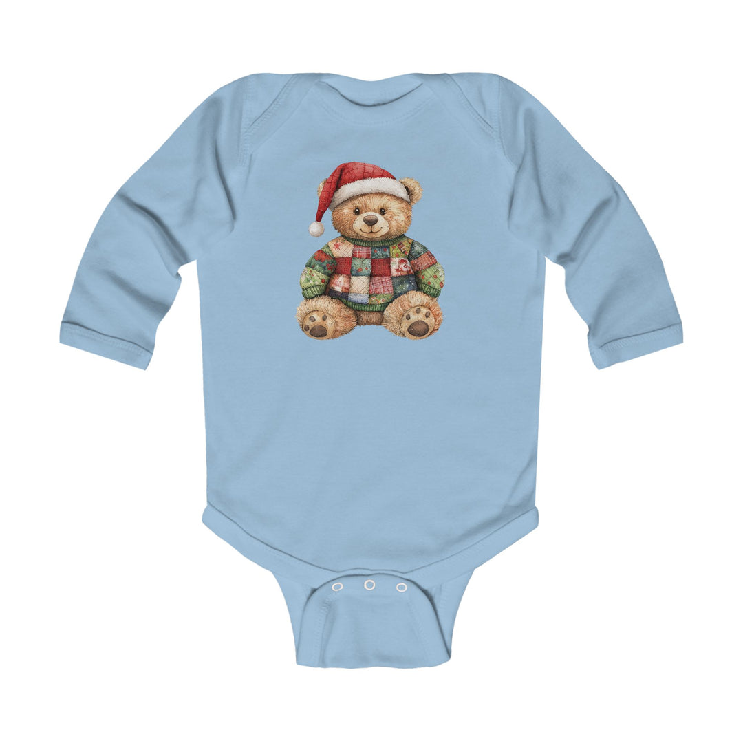 Christmas Bear Onesie: Light-blue, long-sleeve baby bodysuit featuring a teddy bear in a Santa hat and patchwork sweater, made from soft, durable cotton with easy-change snaps.