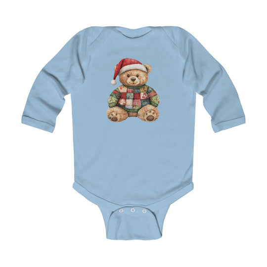 Christmas Bear Onesie: Light-blue, long-sleeve baby bodysuit featuring a teddy bear in a Santa hat and patchwork sweater, made from soft, durable cotton with easy-change snaps.