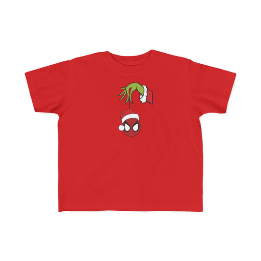 Spider Ball Christmas Toddler Tee with Grinch hand holding Spider-Man ornament; soft cotton, durable print, perfect fit for toddlers' first adventures.