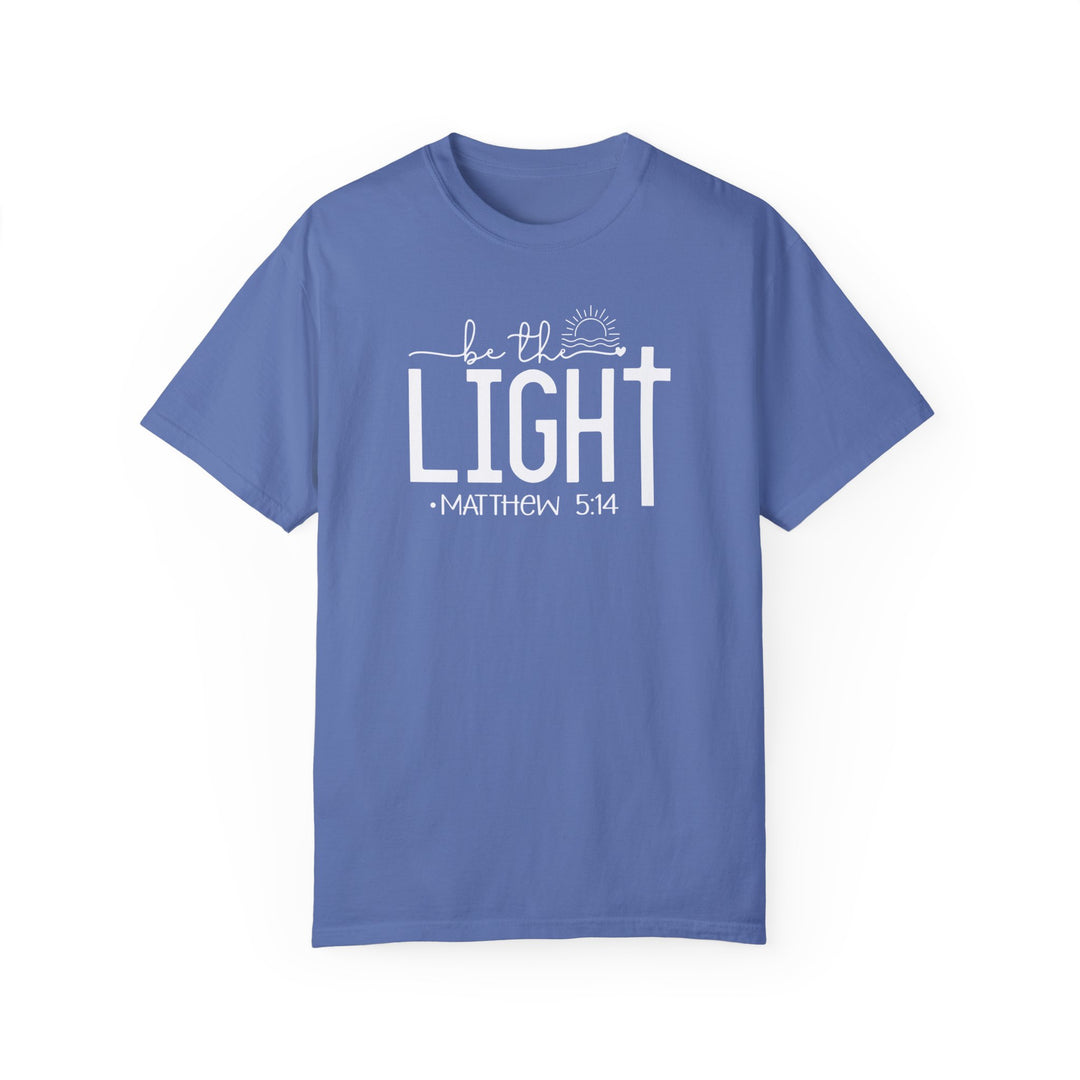 A ring-spun cotton Be the Light Tee, garment-dyed for coziness. Relaxed fit with double-needle stitching for durability. No side-seams for a tubular shape. Sizes S-3XL.