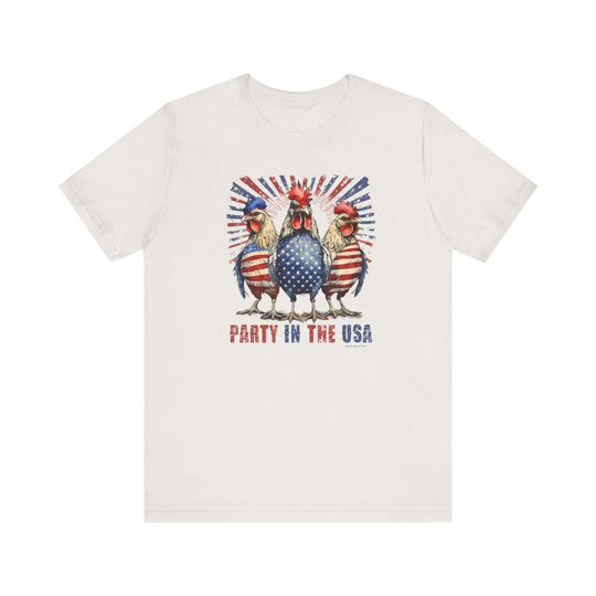 A white t-shirt featuring a whimsical design of roosters and flags, embodying a patriotic theme. Made of soft, 100% Airlume combed cotton with ribbed knit collars for a comfortable fit. From Worlds Worst Tees.