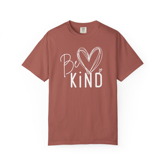 Be Kind Tee featuring a white graphic with heart accents on a rust T-shirt, offering luxurious comfort with a relaxed fit and soft fabric.