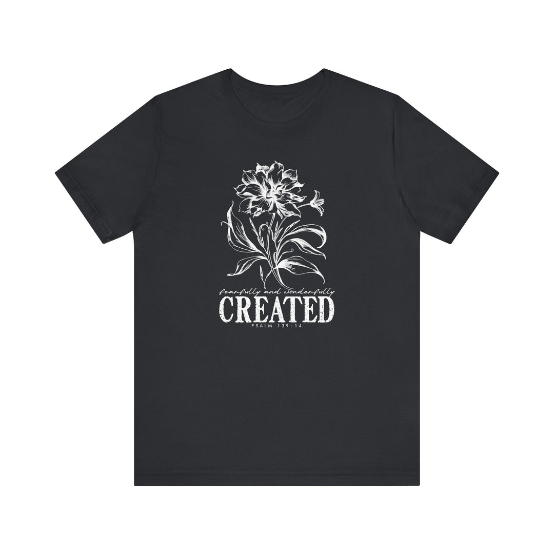 Unisex jersey short sleeve tee, titled Created Tee, features a classic crew neckline and tapered shoulders for a comfortable fit, made from soft, breathable cotton.