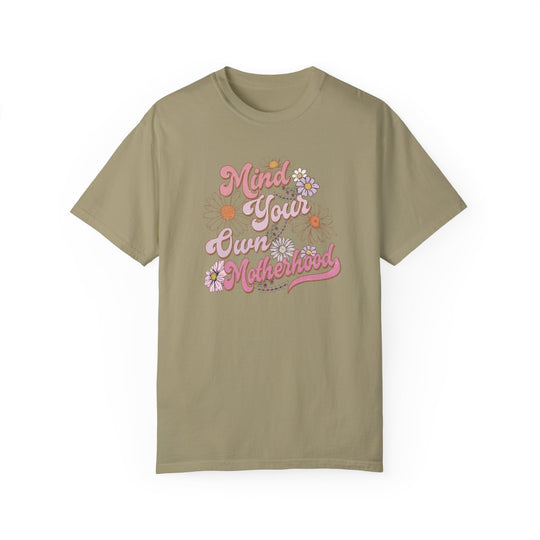A Mind Your Motherhood Tee, garment-dyed with ring-spun cotton, offers cozy comfort with a relaxed fit. Double-needle stitching ensures durability, while seamless sides maintain its shape. Sizes: S-4XL.