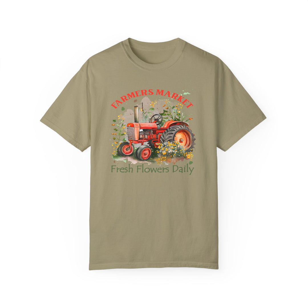 A relaxed fit Fresh Flowers Tee featuring a tractor design on soft ring-spun cotton. Garment-dyed for coziness, with double-needle stitching for durability and a seamless look. From Worlds Worst Tees.