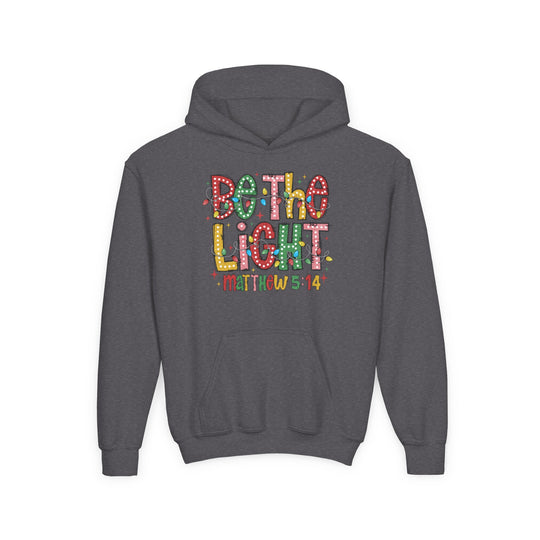Charcoal-gray Be the Light Youth Hoodie featuring festive block letters and holiday-style bulbs, with a kangaroo pocket, made from ultra-soft fleece.