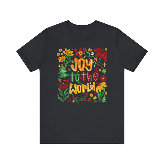 Joy to the World Tee featuring festive holiday motifs, including poinsettias and reindeer, on a dark crew-neck design, perfect for seasonal celebrations.