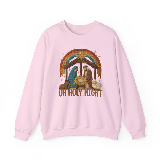Oh Holy Night Crew: Light pink sweatshirt with a Nativity scene, featuring baby Jesus, Mary, and Joseph under a stable, with Oh Holy Night text below.