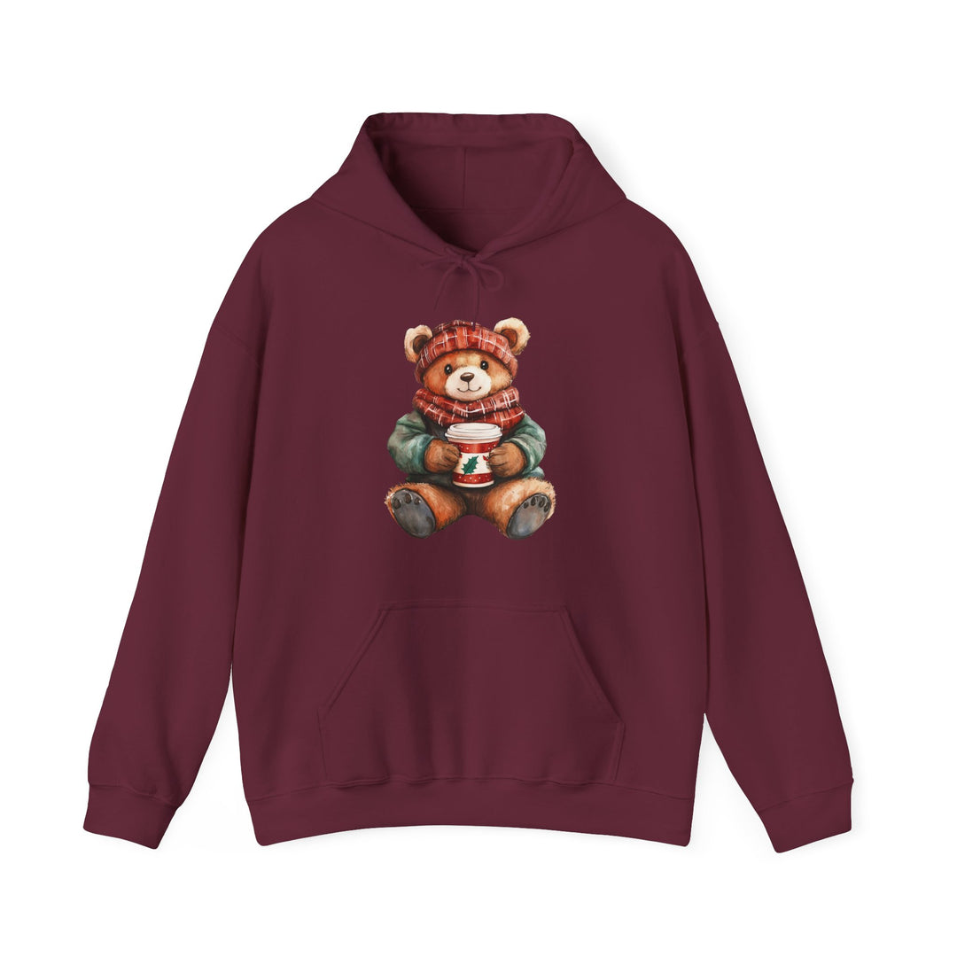Burgundy hoodie featuring a winter-themed teddy bear illustration, showcasing a festive design with a kangaroo pocket, ideal for cozy, stylish wear.