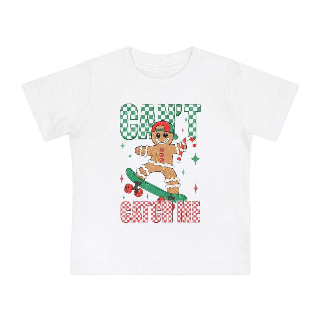 Can't Catch Me Baby Tee with gingerbread on skateboard, candy cane, and festive lettering. Perfectly soft and durable for little ones' adventures.