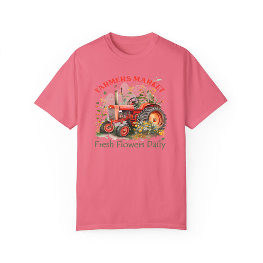 Fresh Flowers Tee: A pink shirt featuring a tractor design, made of 100% ring-spun cotton for a cozy feel. Relaxed fit with double-needle stitching for durability. From Worlds Worst Tees.