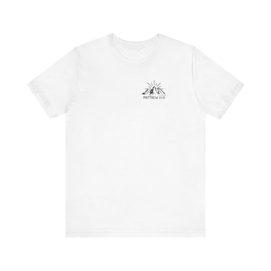 A white t-shirt featuring a logo with mountains and text, embodying the title Faith Can Move Mountains Tee by Worlds Worst Tees. Unisex jersey tee with ribbed knit collars, 100% Airlume combed cotton, and tear away label.