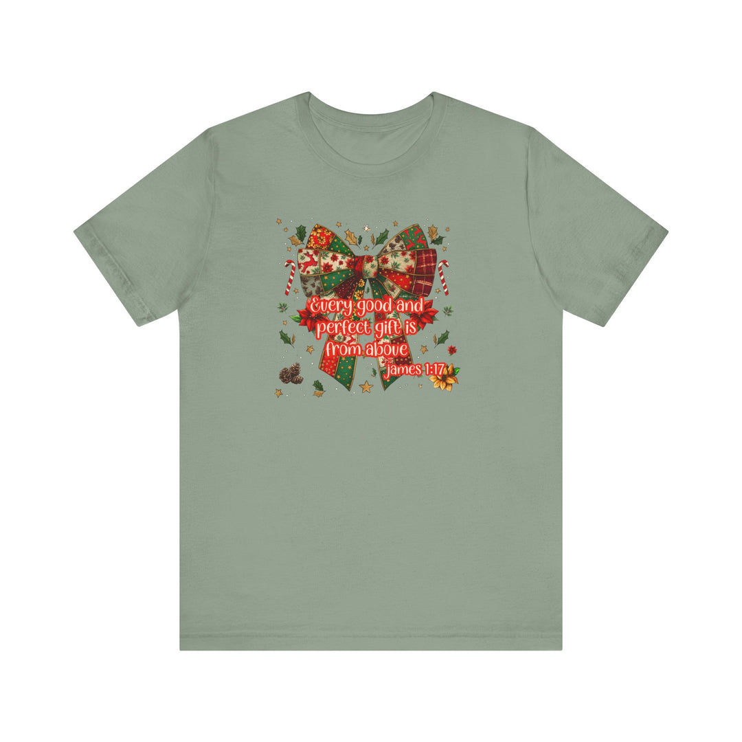 Sage-green T-shirt featuring a festive patchwork bow and Christmas motifs with James 1:17 script, perfect for holiday-themed wear.