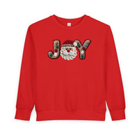 Joy Toddler Crew sweatshirt features JOY with a Santa face and pom-pom details on red fleece, offering warmth and style for toddlers.