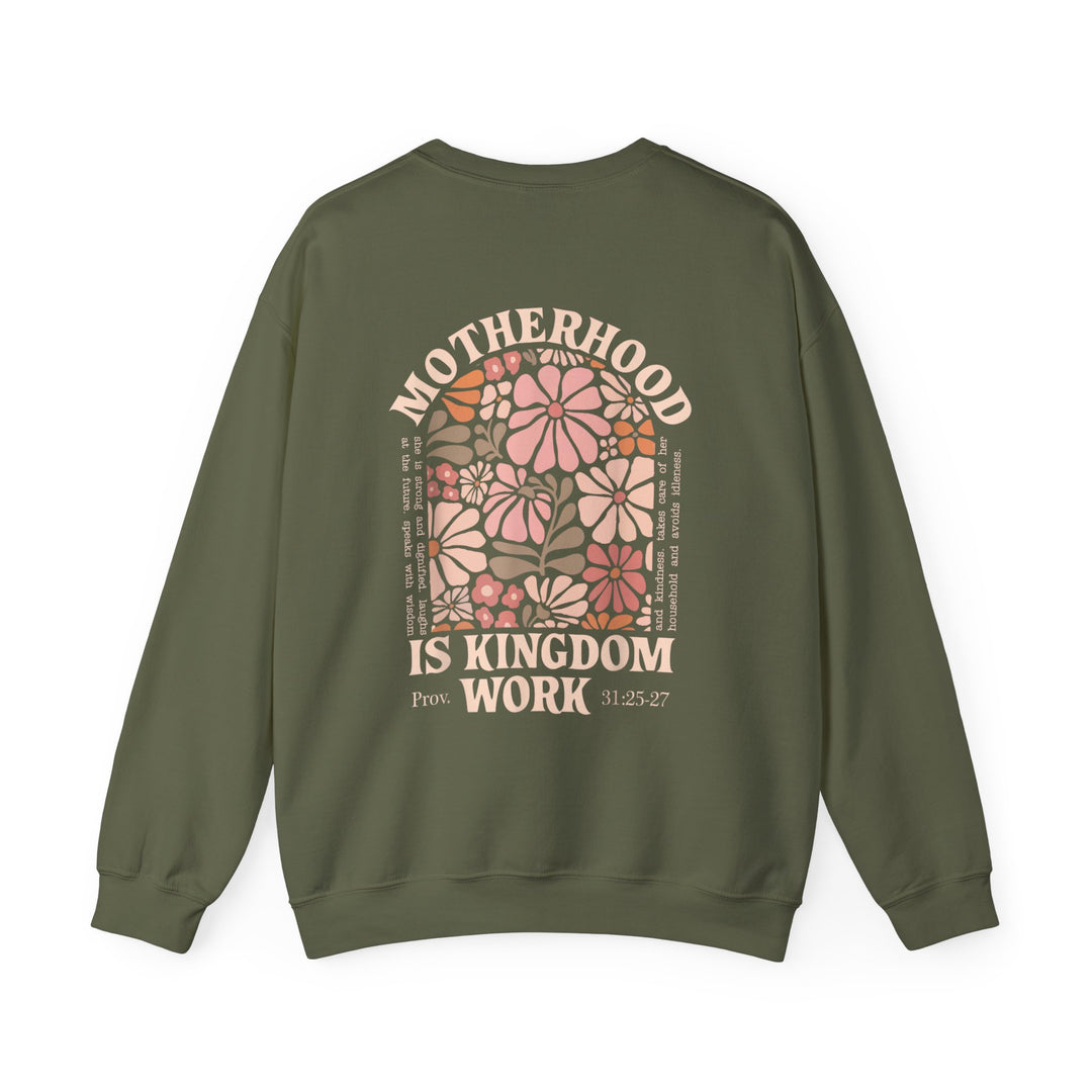 Motherhood Kingdom Work Crew: Olive-green crewneck with retro floral arch, MOTHERHOOD IS KINGDOM WORK text, Proverbs 31 reference, polyester-cotton blend for comfort and durability.