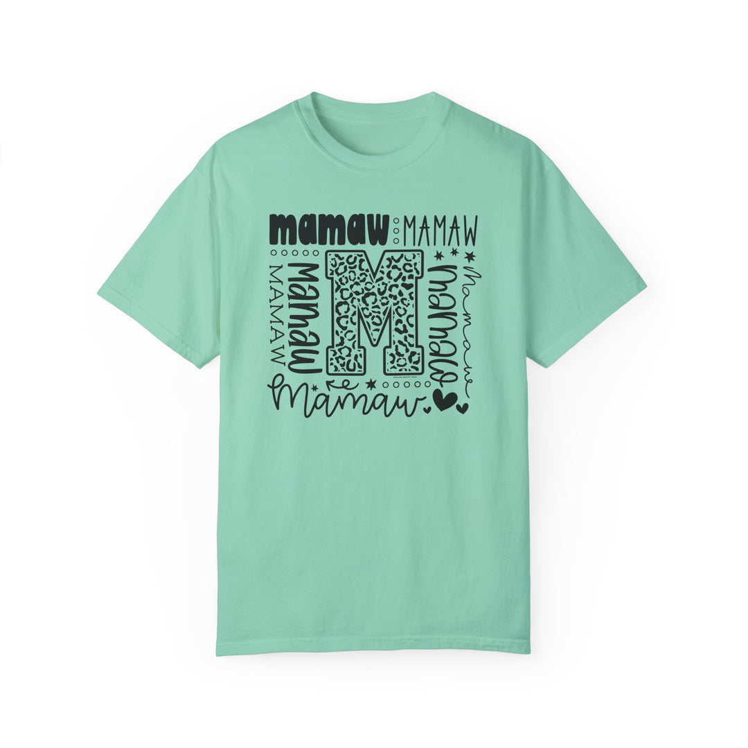 A customizable Mamaw Tee in green with black text, made of 100% ring-spun cotton. Features a relaxed fit, double-needle stitching, and no side-seams for durability and comfort. Ideal for daily wear.