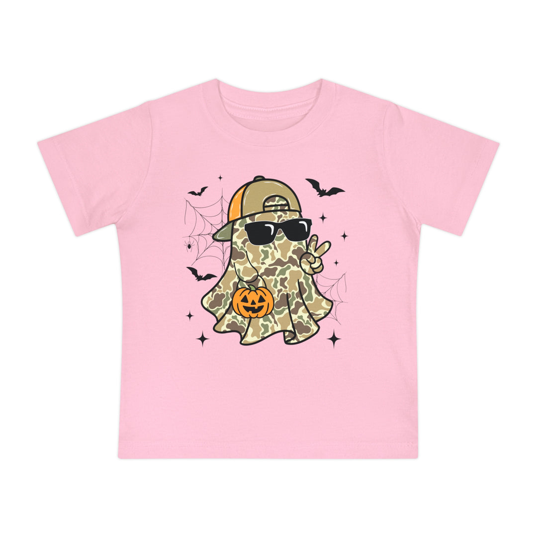 Candy Ghost Baby Tee: Light-pink, short-sleeve kids' t-shirt featuring a playful Halloween motif with a cool camouflage-ghost, peace sign, and pumpkin bucket. Super soft, durable fit.