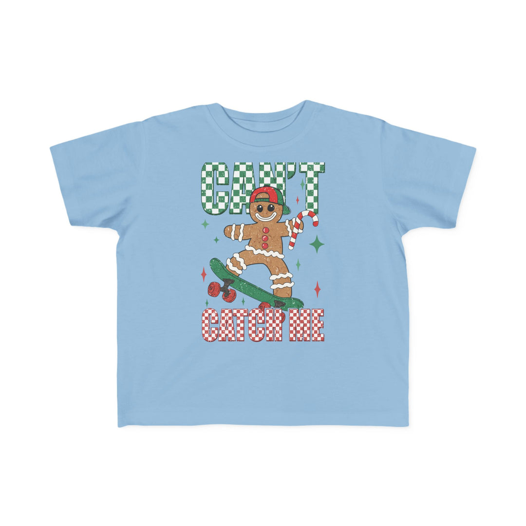 Can't Catch Me Toddler Tee featuring a gingerbread man on a skateboard with festive text, designed for comfort and durability, ideal for toddlers' adventures.