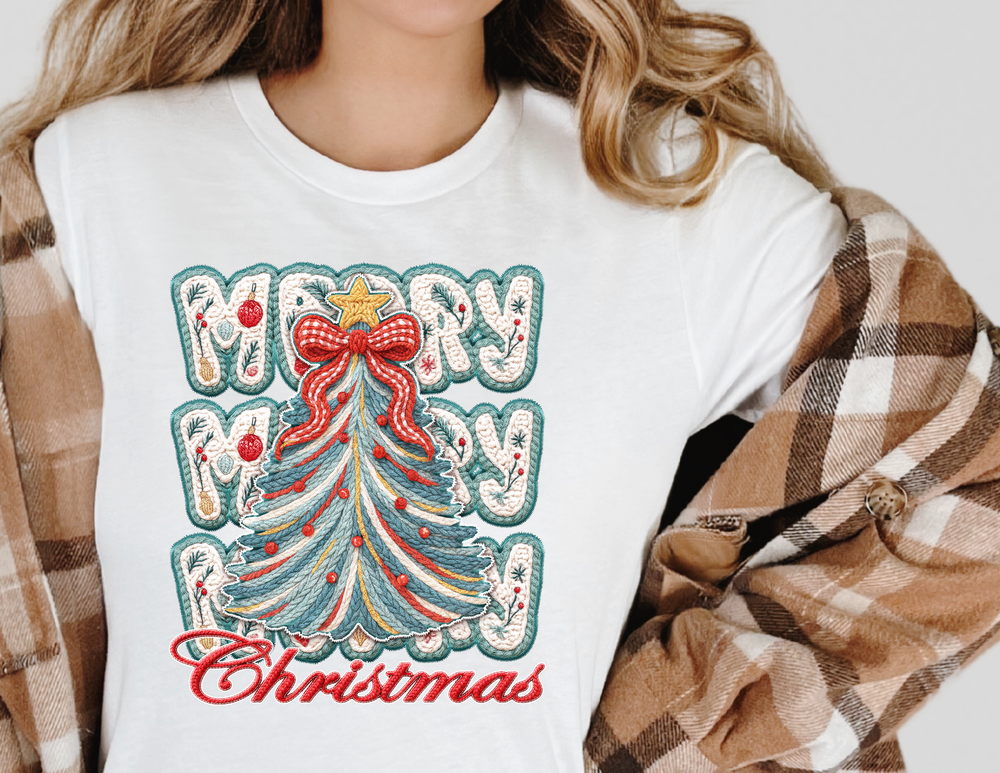 Person wearing Merry Christmas Tree Tee with festive embroidered-style graphic, featuring a yarn-like Christmas tree and MERRY MERRY Christmas text, under a plaid shacket.