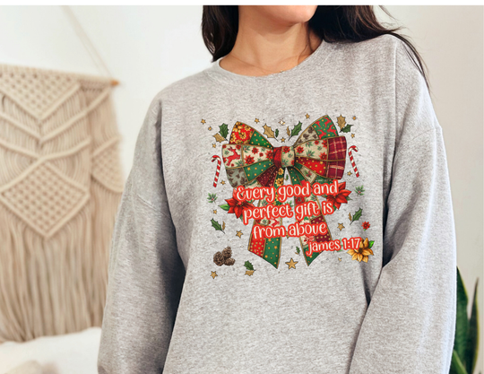 Woman wearing the Gift from Above Crew sweatshirt, featuring a festive patchwork Christmas bow with holly and candy canes, and script from James 1:17.