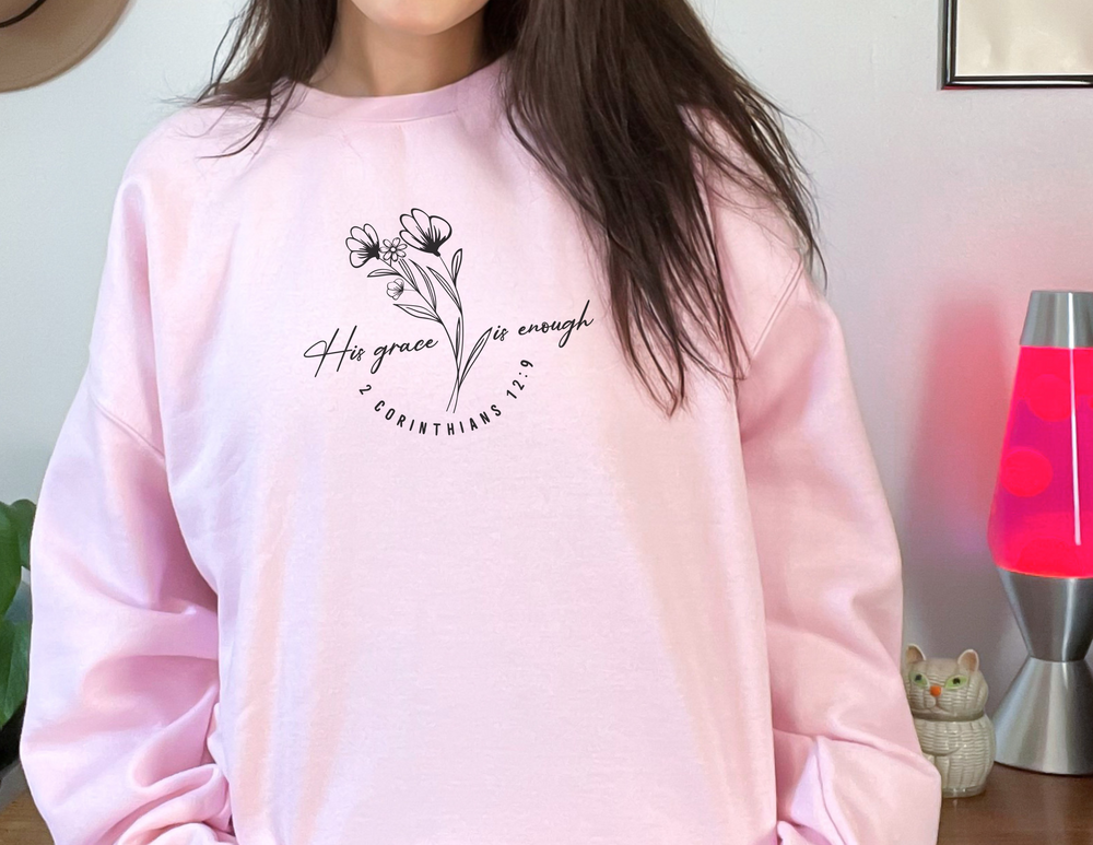 A unisex heavy blend crewneck sweatshirt, His Grace Is Enough Crew, in various sizes. Made from 50% cotton and 50% polyester for comfort and durability. Features ribbed knit collar and double-needle stitching for a classic fit.