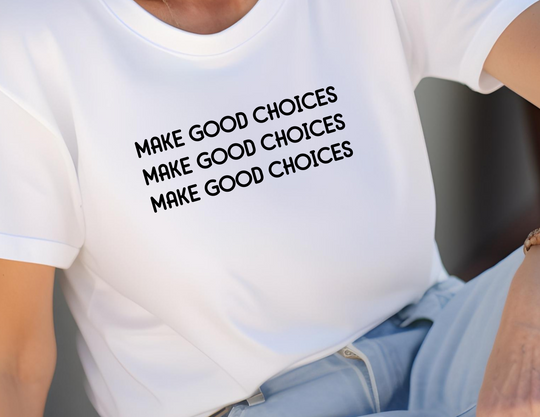 A white soft-style tee featuring a person's shoulder and back, embodying casual comfort. Unisex, 100% cotton with twill tape shoulders, ribbed collar, and Eurofit waist. Make Good Choices Tee by Worlds Worst Tees.