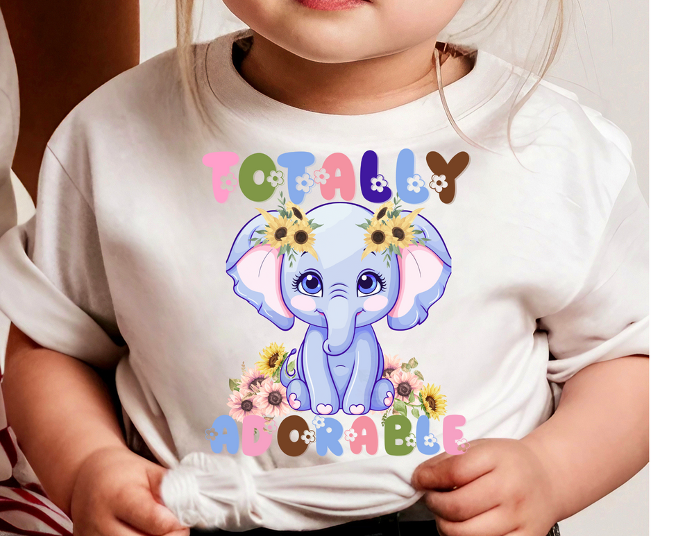 Totally Adorable Toddler Tee, a short sleeve, 100% cotton shirt designed for comfort with a tear-away label, perfect for everyday wear by toddlers.