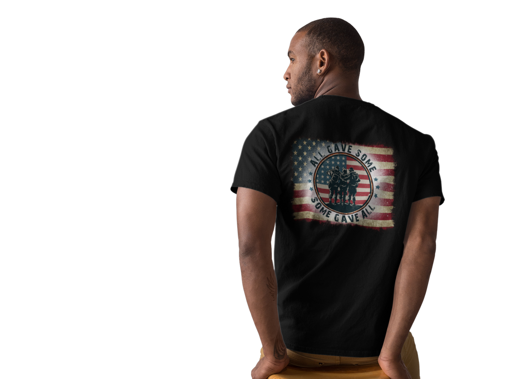 A classic USA Some Gave All Tee featuring a man in a black shirt with a flag, embodying patriotism. Unisex jersey tee with ribbed knit collars, taping on shoulders, and dual side seams for durability.