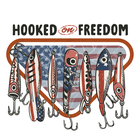 Hooked on Freedom Tee featuring Americana-themed fishing lures with stars-and-stripes badge, perfect for a casual, patriotic look. Comfortable, durable, and available in multiple sizes.