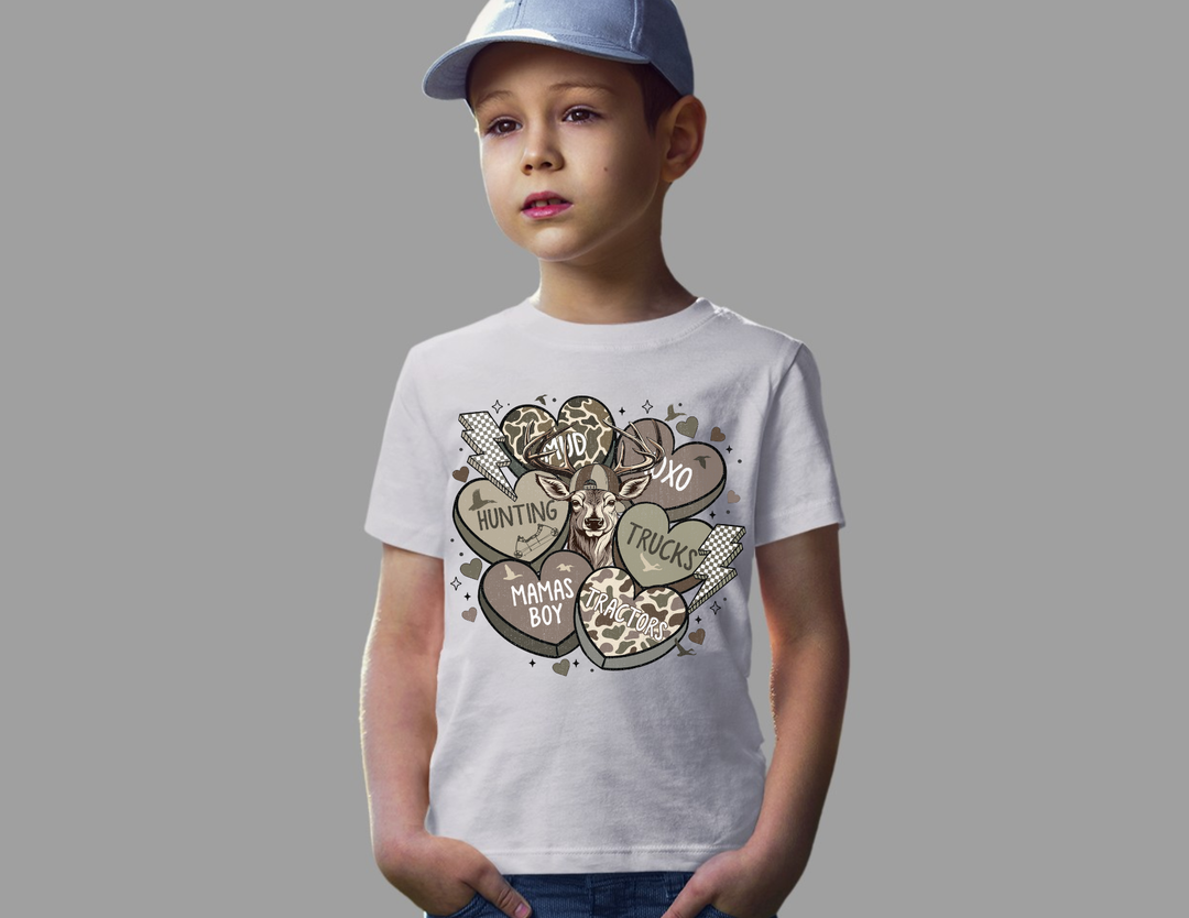 Young boy wearing Boy Valentine Kids Tee featuring deer head graphic with themed words, embodying a playful and trendy style for active kids.