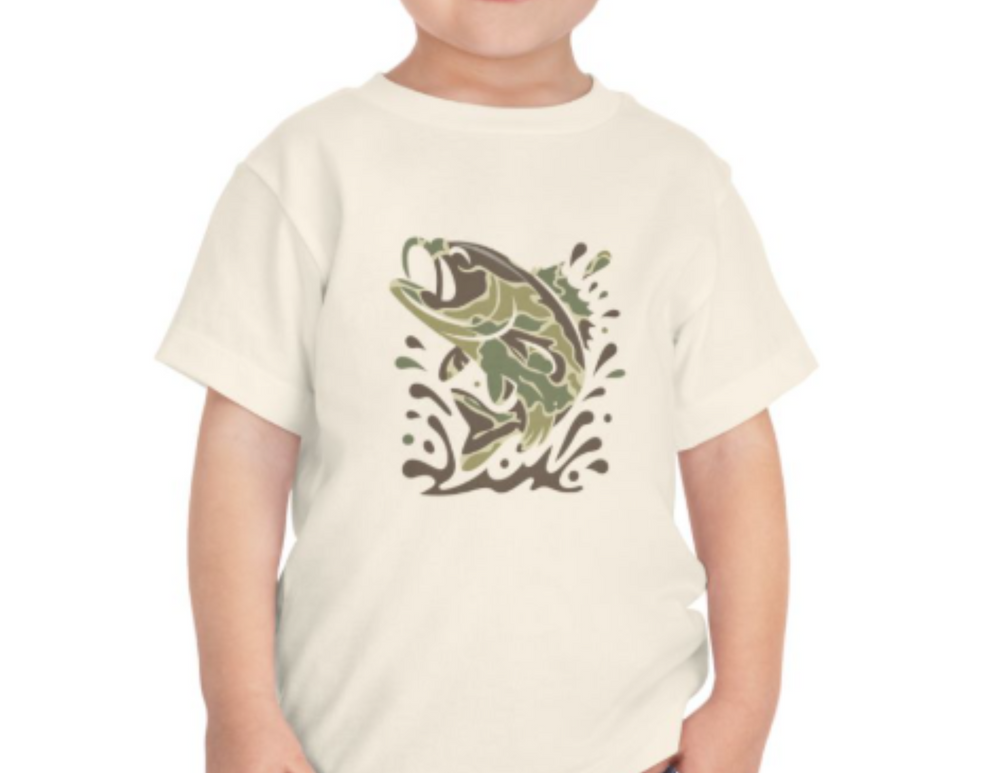 Child wearing Camo Fish Kids Tee with a woodland-style camo fish graphic, showcasing leaping fish in water on a light-colored, durable cotton T-shirt.