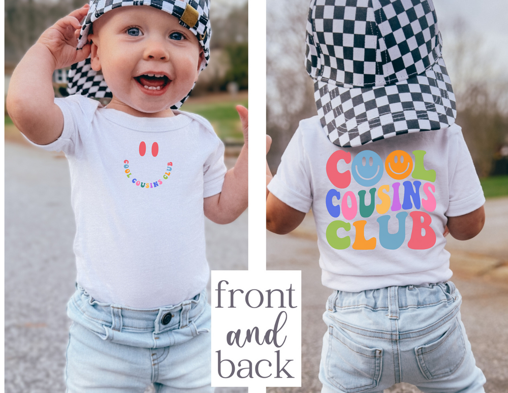Infant unisex Cool Cousins Club onesie, featuring a soft, ribbed design with lap shoulders for easy dressing, made primarily from ring-spun cotton.