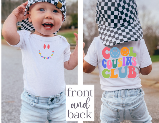 Infant unisex Cool Cousins Club onesie, featuring a soft, ribbed design with lap shoulders for easy dressing, made primarily from ring-spun cotton.