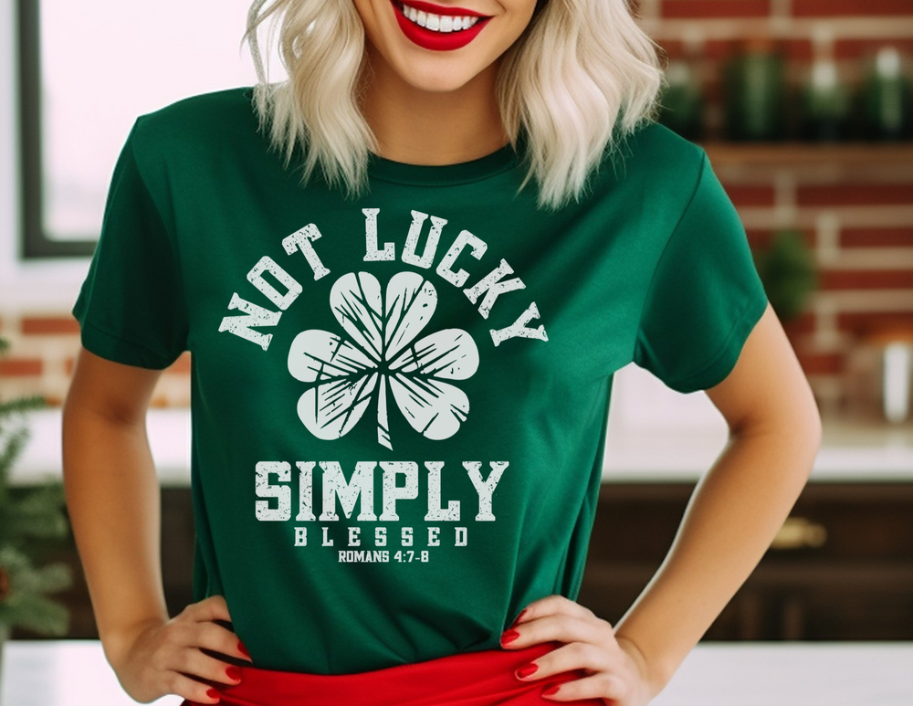 Woman in a green Not Lucky Tee with white clover, smiling, showcasing the shirt's casual fit and soft cotton material.
