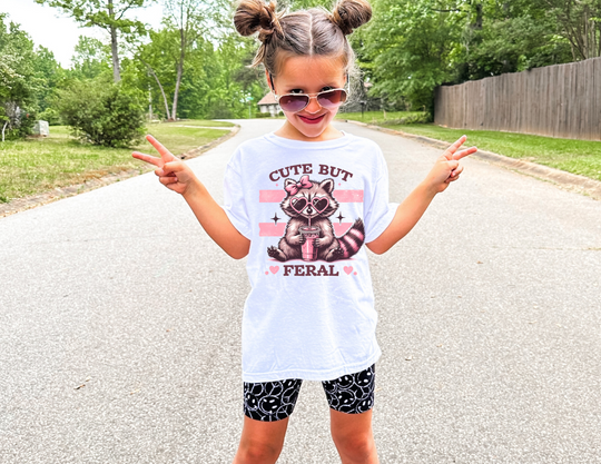 Cute but Feral Kids Tee, a soft, 100% combed cotton t-shirt with a classic fit, designed for active kids' comfort and agility.