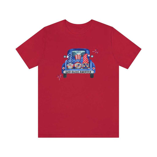 American Gnomies Tee: Red shirt featuring a car with gnomes design. Unisex jersey tee with ribbed knit collar, retail fit, 100% cotton, light fabric, and quality print. From Worlds Worst Tees.